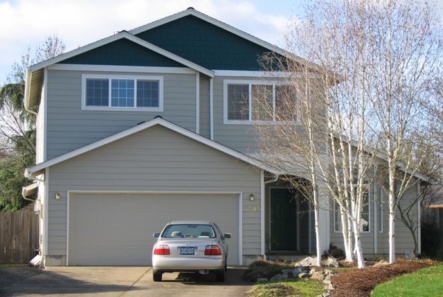 Over-the-garage addition in Corvallis looks as though it is part of the original home.