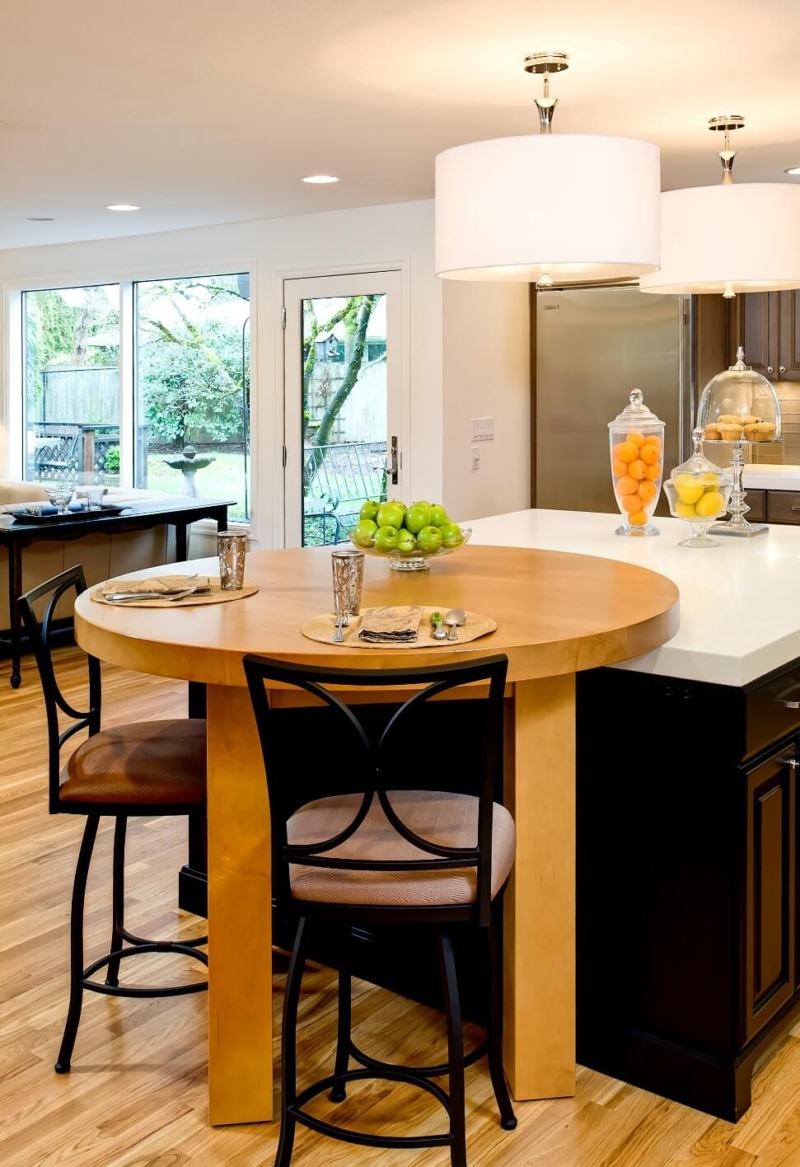 An inventive custom table in the remodeled kitchen can rest on the counter or stand freely.