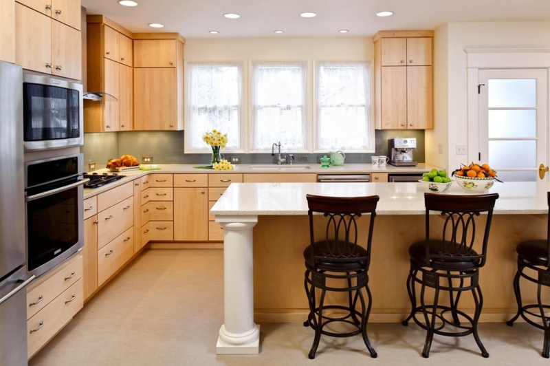 Kitchen renovation featuring Caesarstone countertops and flat-slab cabinet doors and drawers made of maple. Historic home renovation detail