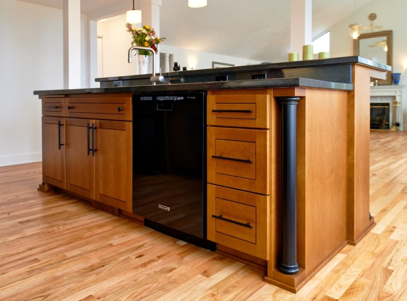 Biedemeier look cabinets and “Polished Mosaic” countertops by Wilsonart with a black granite gem loc edge. Loft kitchen remodel with modern cabinetry