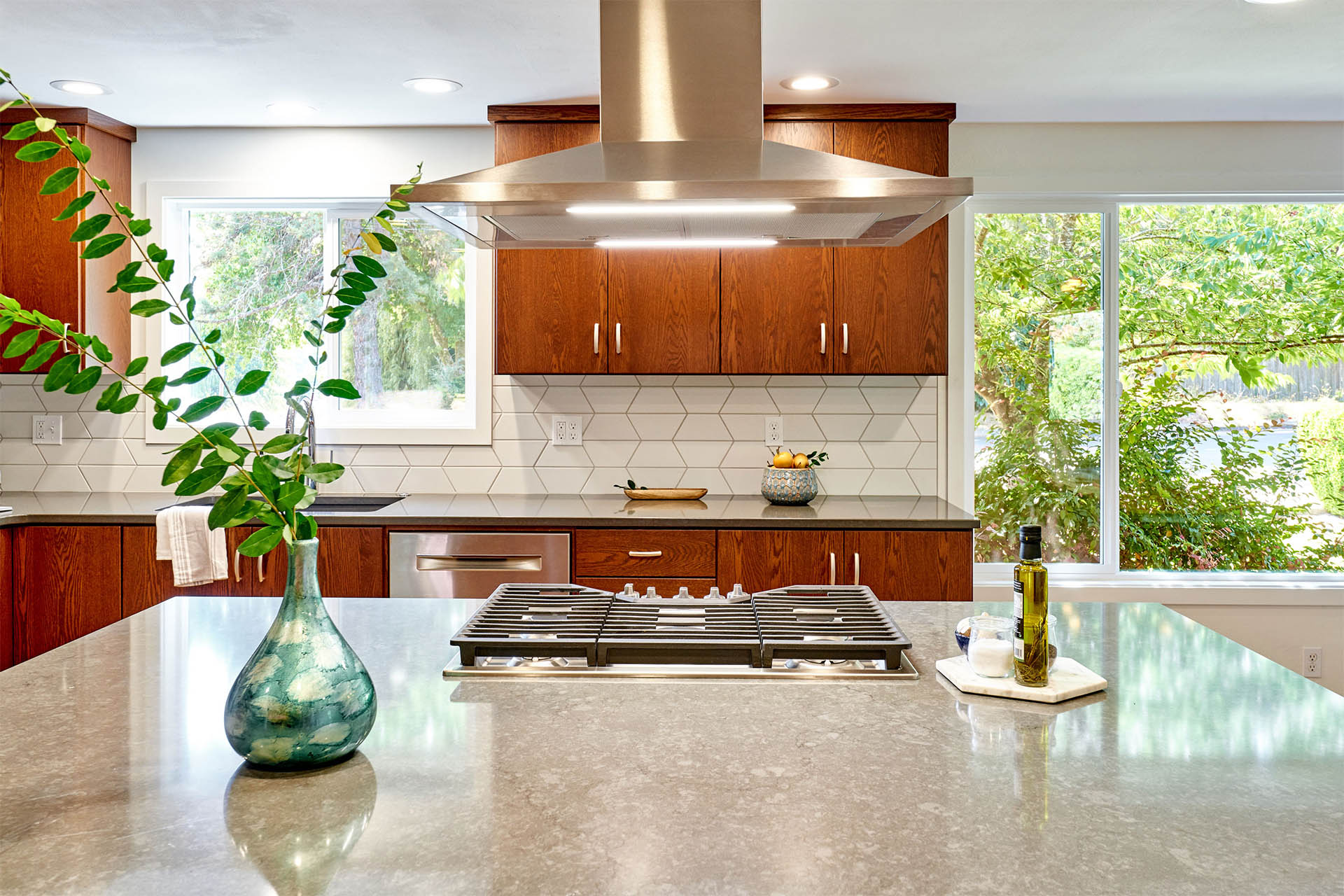 gray quartz countertop on island with natural wood cabinetry 