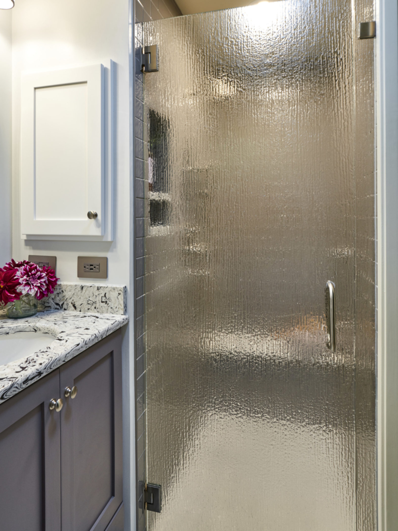 updated contemporary bathroom remodel gray custom vanity with recessed medicine cabinet and frosted glass shower door