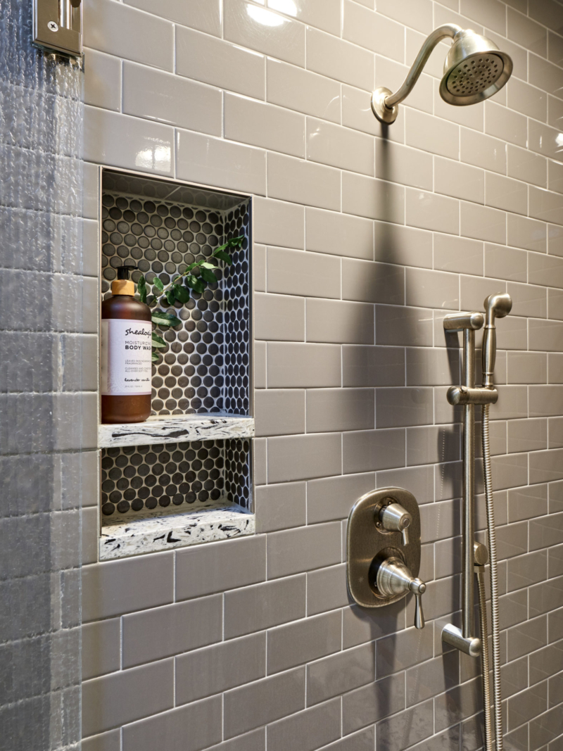 updated shower with niche niche in gray tile shower with shelves made of quartz