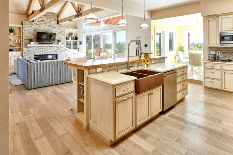 kitchen island overlooks living room with timber beams 