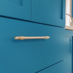 Closeup of blue drawer with satin nickel pull
