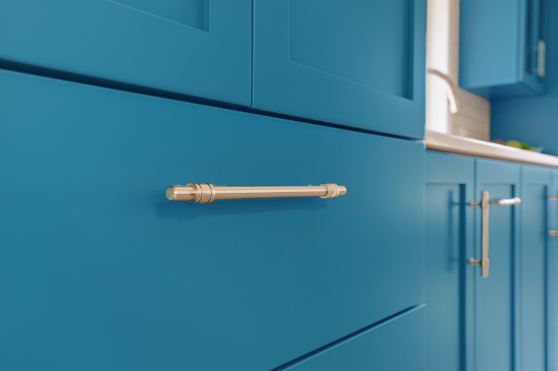 Closeup of blue drawer with satin nickel pull