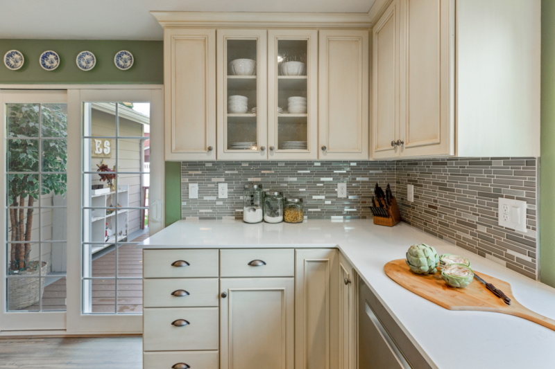 Patio door view featuring glass cabinet doors