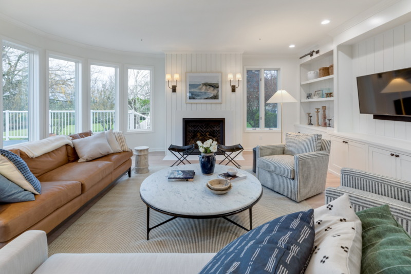 Living room remodel with shiplap fireplace surround and cozy furniture