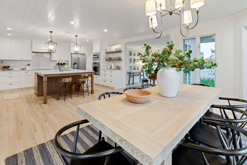 Redesigned dining area Dining room table in open kitchen with hardwood floors