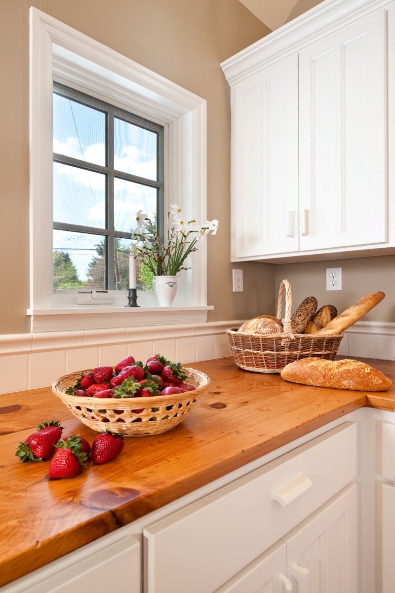This newly remodeled kitchen features pine counter tops with white painted cabinets. This newly remodeled kitchen features pine counter tops with white painted cabinets.