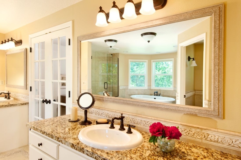 The remodeled bathroom features two vanities for plenty of elbow room. The remodeled bathroom features two vanities for plenty of elbow room.