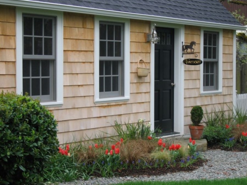 Alaskan yellow cedar siding was used used to authentically replicate the Cape Cod style. Alaskan yellow cedar siding was used used to authentically replicate the Cape Cod style.