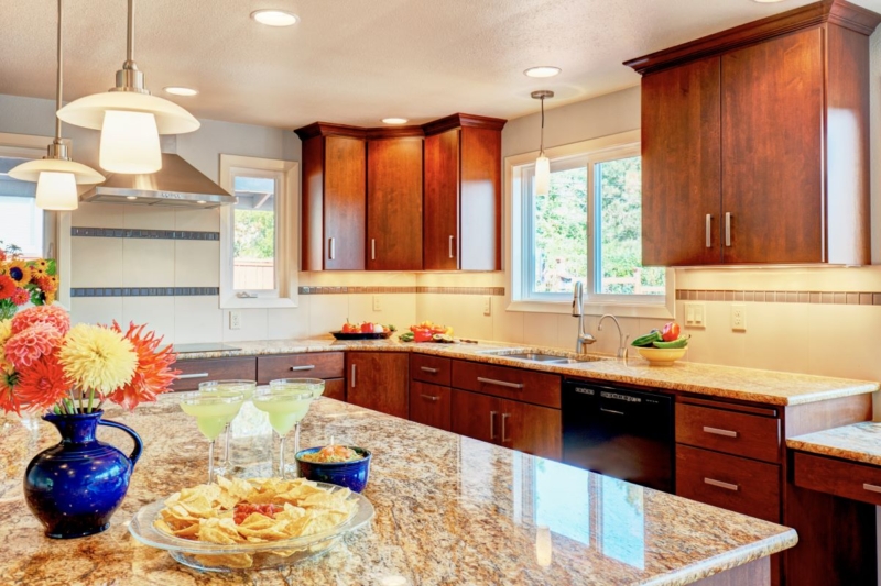 Custom cabinets and granite countertops This Corvallis kitchen features custom maple cabinets and granite counters.