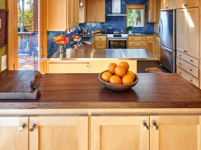Kitchen design features fresh and vibrant elements After photo featuring kitchen design with similar layout but new finishes