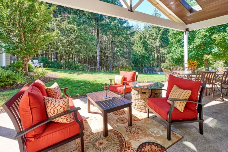 Patio couches, coffee table, area rug and gas firepit create a cozy outdoor space for relaxing. Patio couches, coffee table, area rug and gas firepit create a cozy outdoor space for relaxing.
