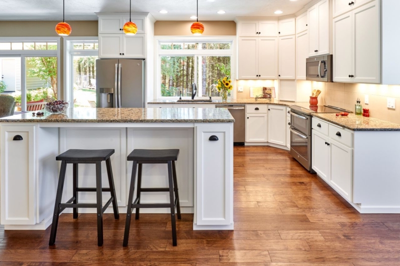 Island dining on quartz countertops is provided inside the new kitchen remodel.