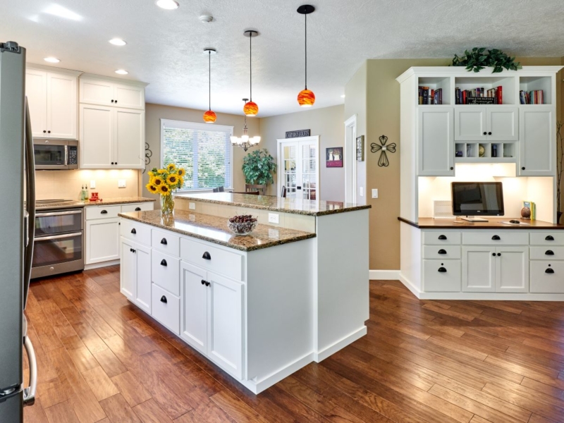 Open concept kitchen and dining area remodel The newly remodeled kitchen features an open floor plan.