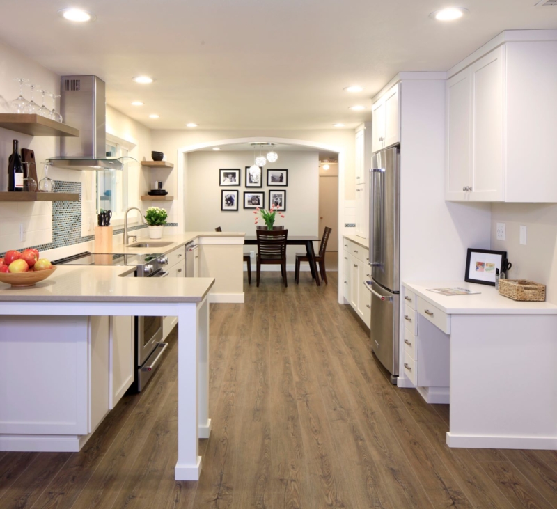 The remodel visually connects the kitchen and dining room with the use of an arch.