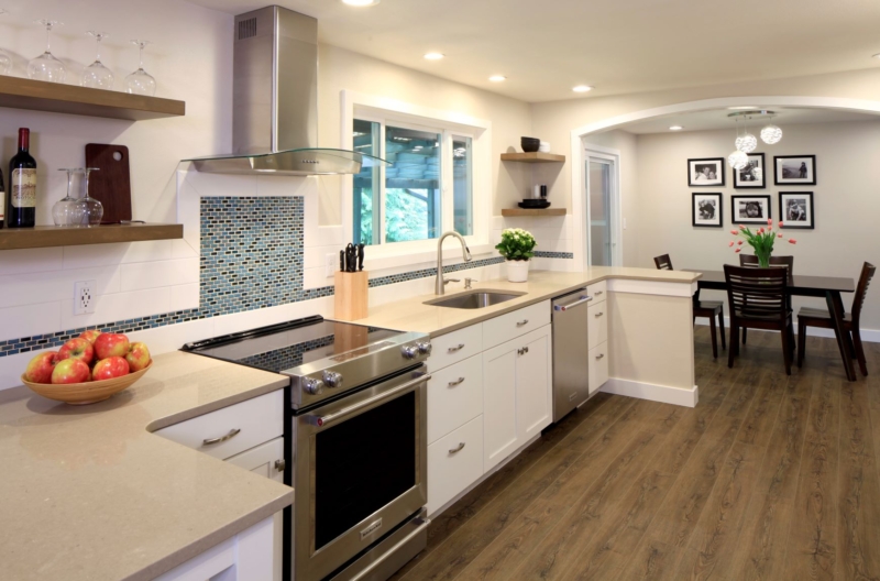 This redesigned white contemporary kitchen acts as the central hub of the home.