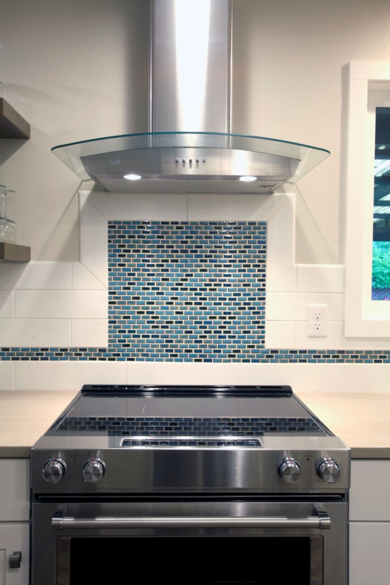 The remodeled kitchen reflects the homeowners' contemporary style.