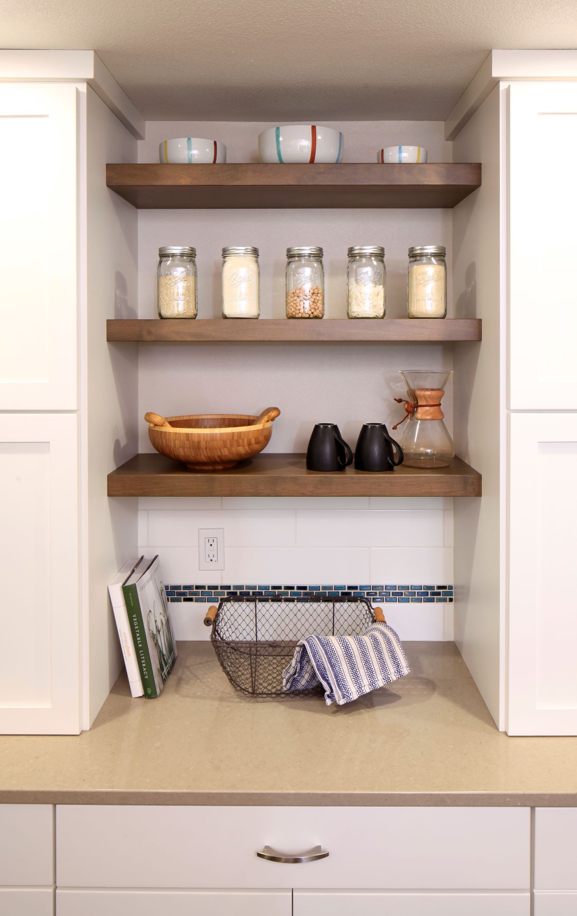 Open shelves create an airy contemporary feel in this kitchen remodel.
