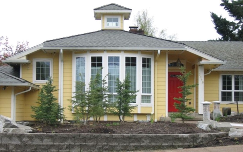 This addition converted an existing garage into a living room and entryway.