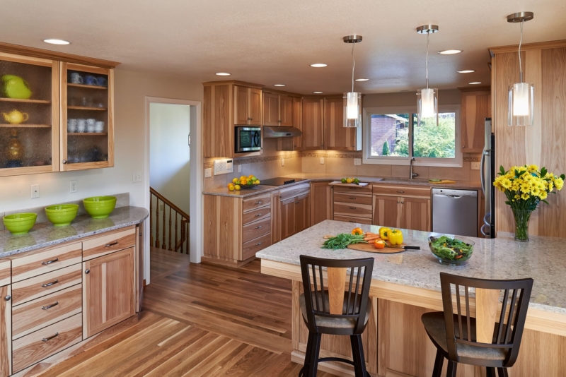 Quarter-sawn hickory cabinet doors expand on the rustic theme in this kitchen remodel. Quarter-sawn hickory cabinet doors expand on the rustic theme in this kitchen remodel.