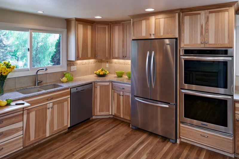 Distinctive hickory cabinets and wall ovens. This distinctive kitchen remodel reflects the customer's love of hickory.