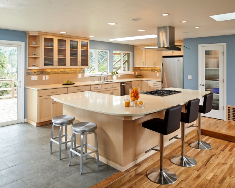 Caesarstone countertops and maple cabinetry The remodeled kitchen provided room for a generous island.