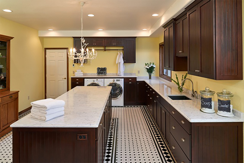 A large laundry room island with Silestone counters. A large laundry room island with Silestone counters.