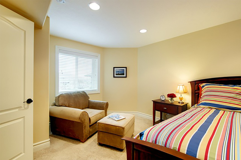 The cozy bedroom with a seating area. The cozy bedroom with a seating area.