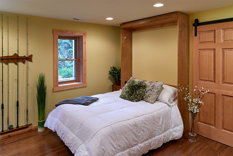 A murphy bed folds down when guests come to visit. A murphy bed folds down when guests come to visit.