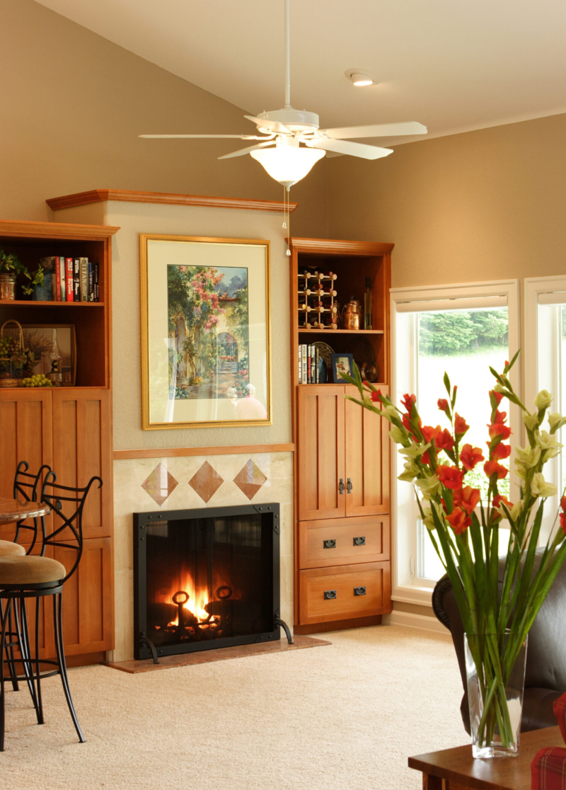 Beautiful gas fireplace with custom cabinetry surrounding. Beautiful gas fireplace with custom cabinetry surrounding.