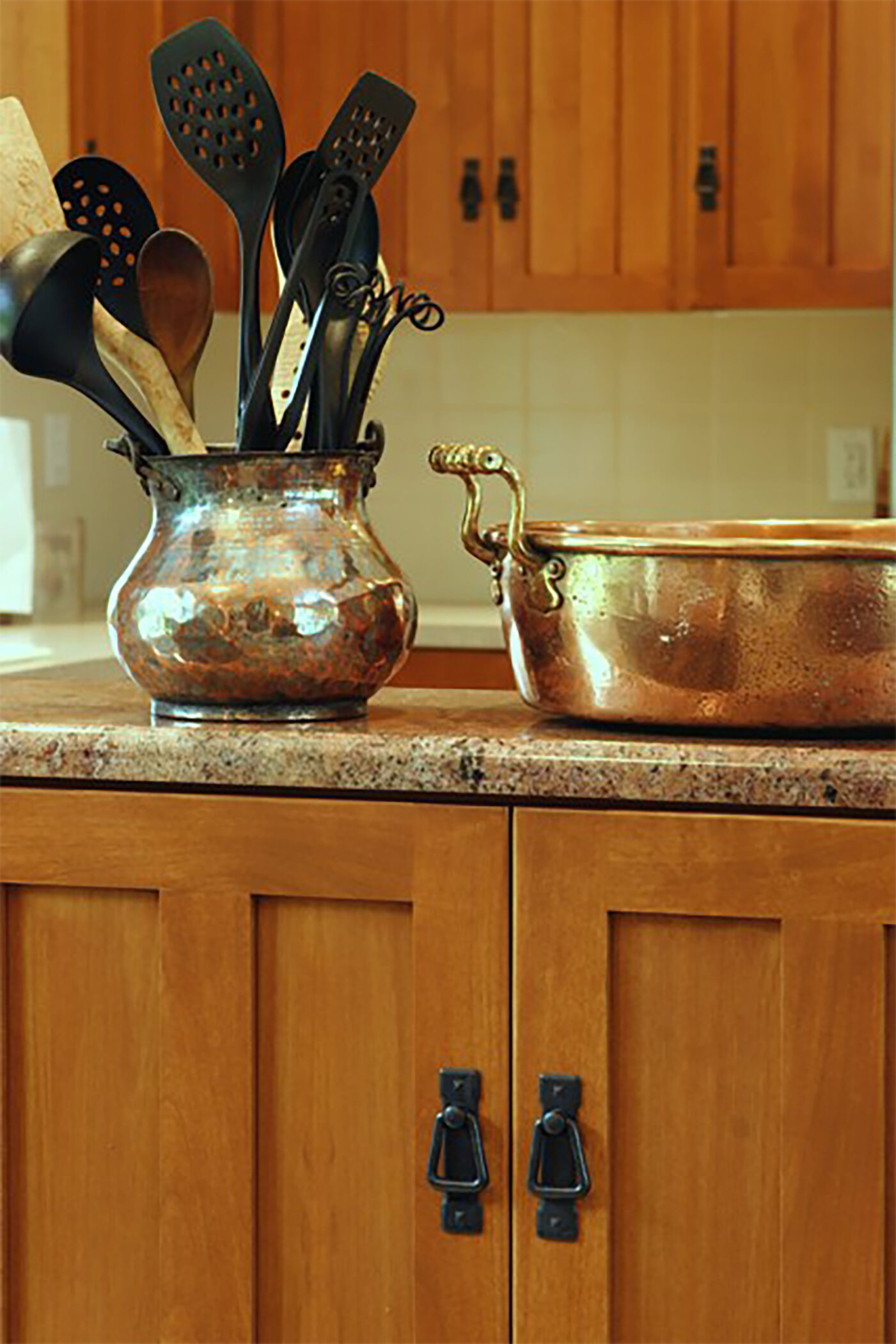 Granite countertops with shaker style cabinets.