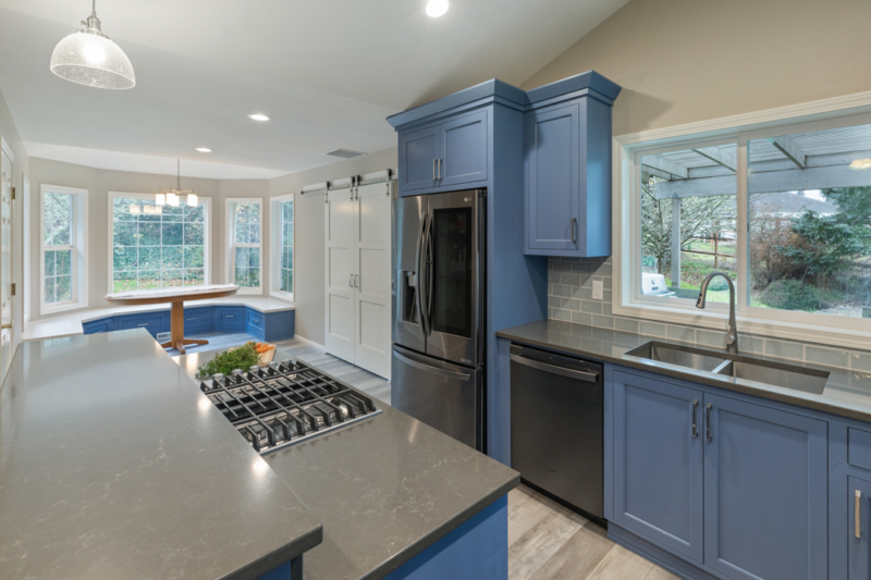 Gas grill in two-tiered kitchen island. Gas grill in two-tiered kitchen island by Powell Construction.
