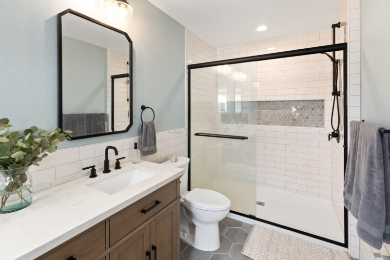 Shower in Primary Ensuite Bath-Powell Construction-Corvallis OR Black fixtures provide accent to serene tones in primary bath