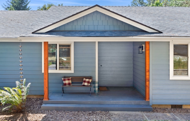 Front porch addition on ranch style home remodel by Powell Construction.