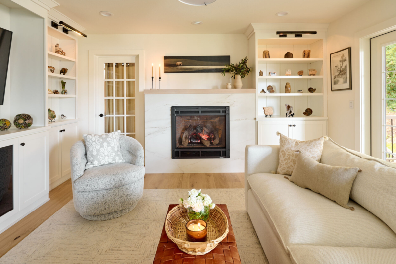 Veined marble fireplace surround in family remodel by Powell Construction of Corvallis OR