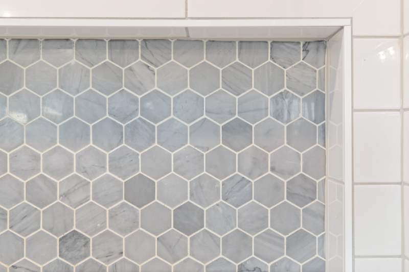 Hexgonal accent tile in shower niche Hexgonal accent tile in shower niche