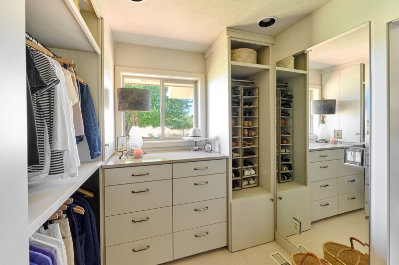 Luxurious walk in closet in primary suite Luxurious walk in closet in primary suite remodel by Powell Construction