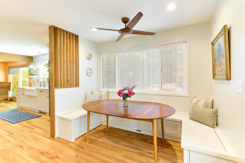 A slatted-wood accent wall brings mid-century style to this dining nook. Designed and built by Powell Construction A slatted-wood accent wall brings mid-century style to this dining nook.