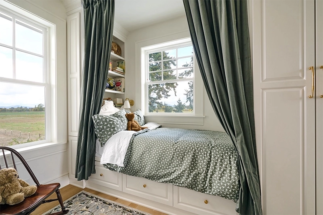 Bunkroom with corner windows offers view of the gorgeous property.