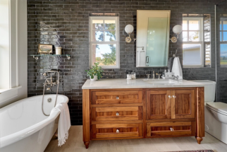 Walnut, custom vanity with black tile backsplash