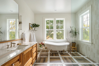 Primary suite bathroom with tub