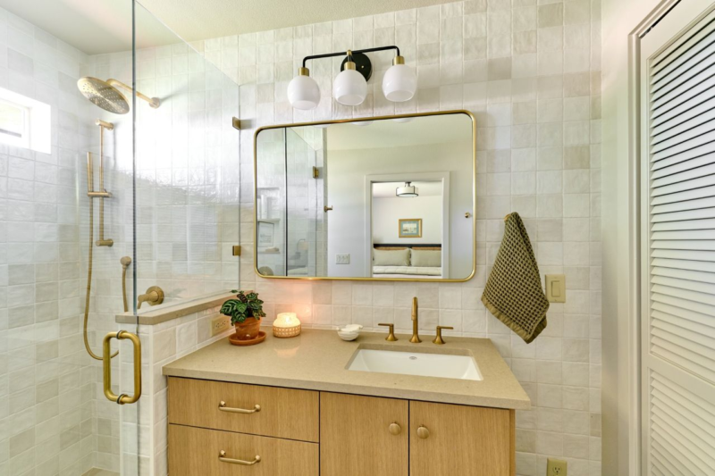 Guest suite bath with walk in shower, tile walls and neutral vanity