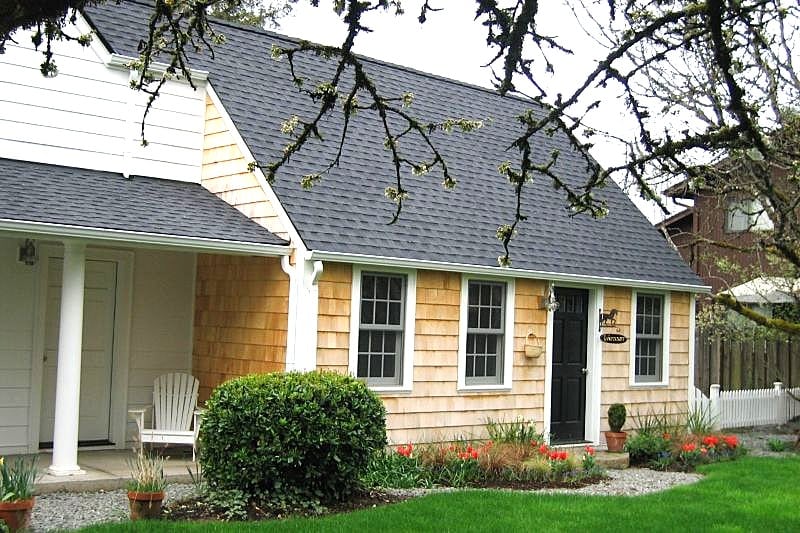 This is a quintessential Cape Cod style shop addition by Powell Construction.