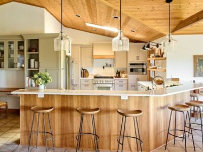 For this contemporary, yet rustic kitchen remodel, we used the existing wood paneled ceiling at a starting point and incorporated wood elements in the kitchen remodel that made the finished look cohesive.
