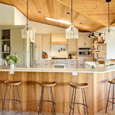 For this contemporary, yet rustic kitchen remodel, we used the existing wood paneled ceiling at a starting point and incorporated wood elements in the kitchen remodel that made the finished look cohesive.