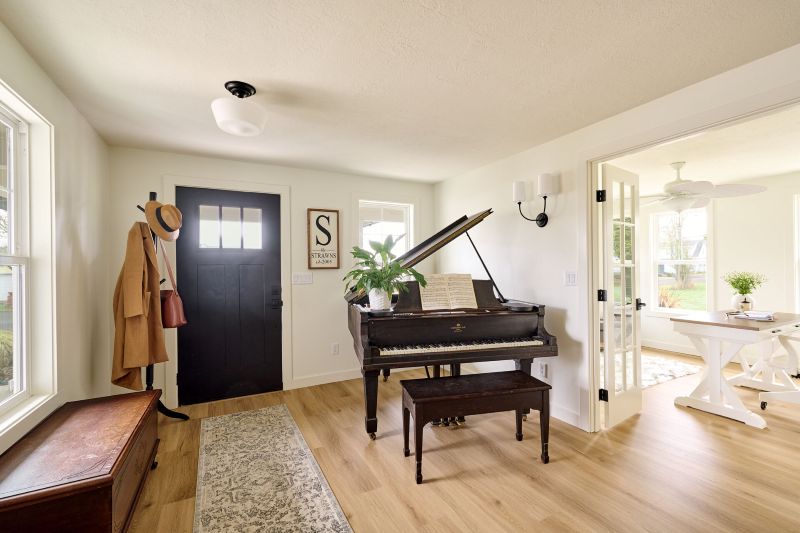 Spacious entryway and home office created during remodel by Powell Construction.