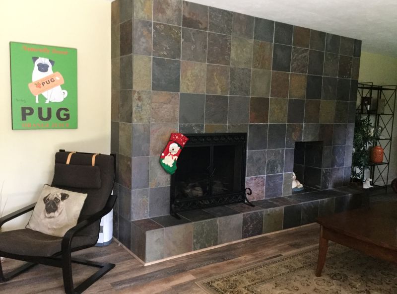 Large, double-side wood burning fireplace. Prior to the remodel, it dominated the space visually and cut off the dining room from the kitchen.